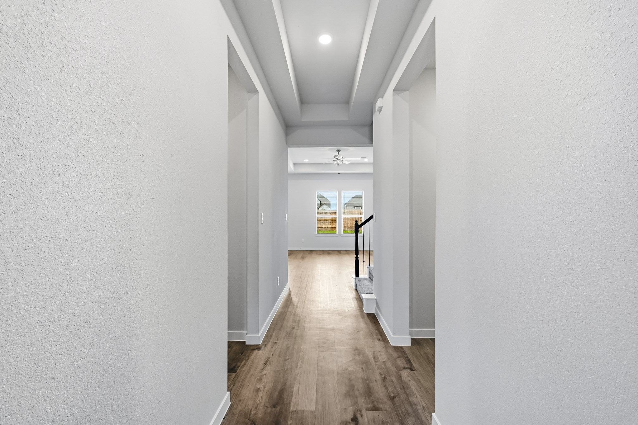A hallway with white walls.