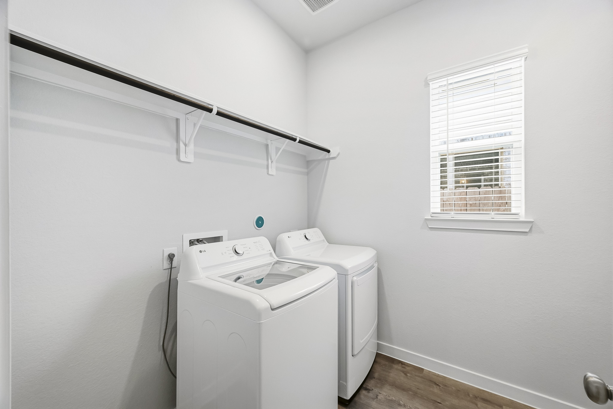 A laundry room with a washer and dryer.
