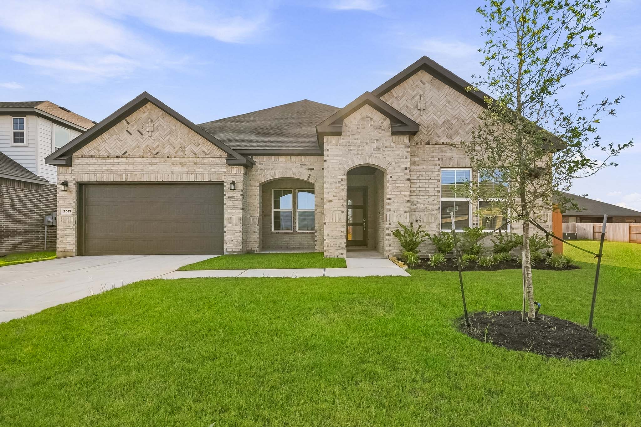 A house with a large front yard.