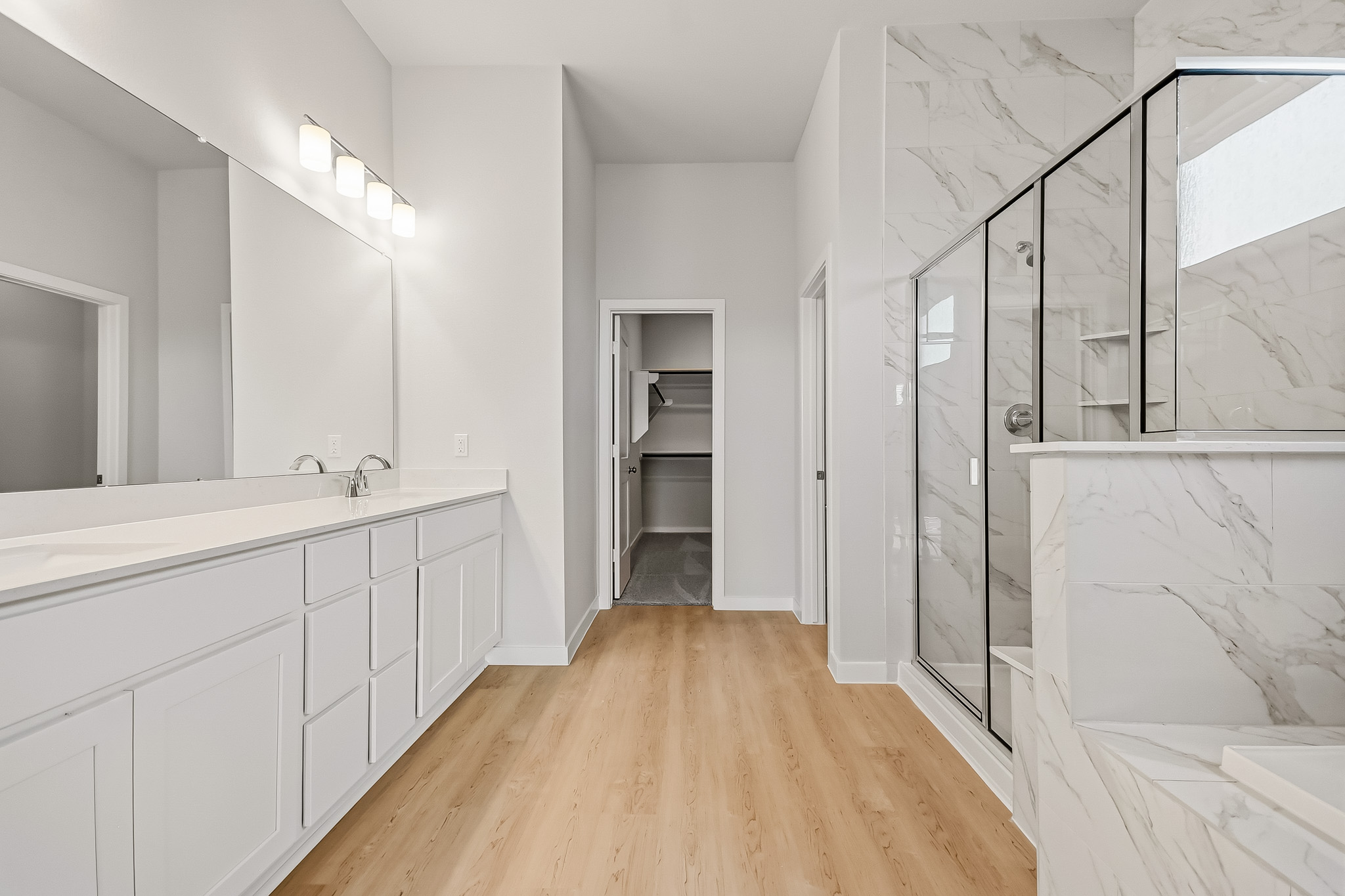 A bathroom with a glass shower.