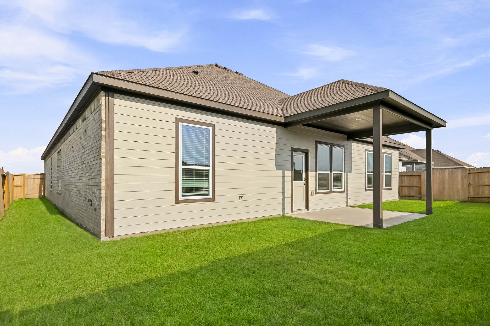 A house with a grass yard.