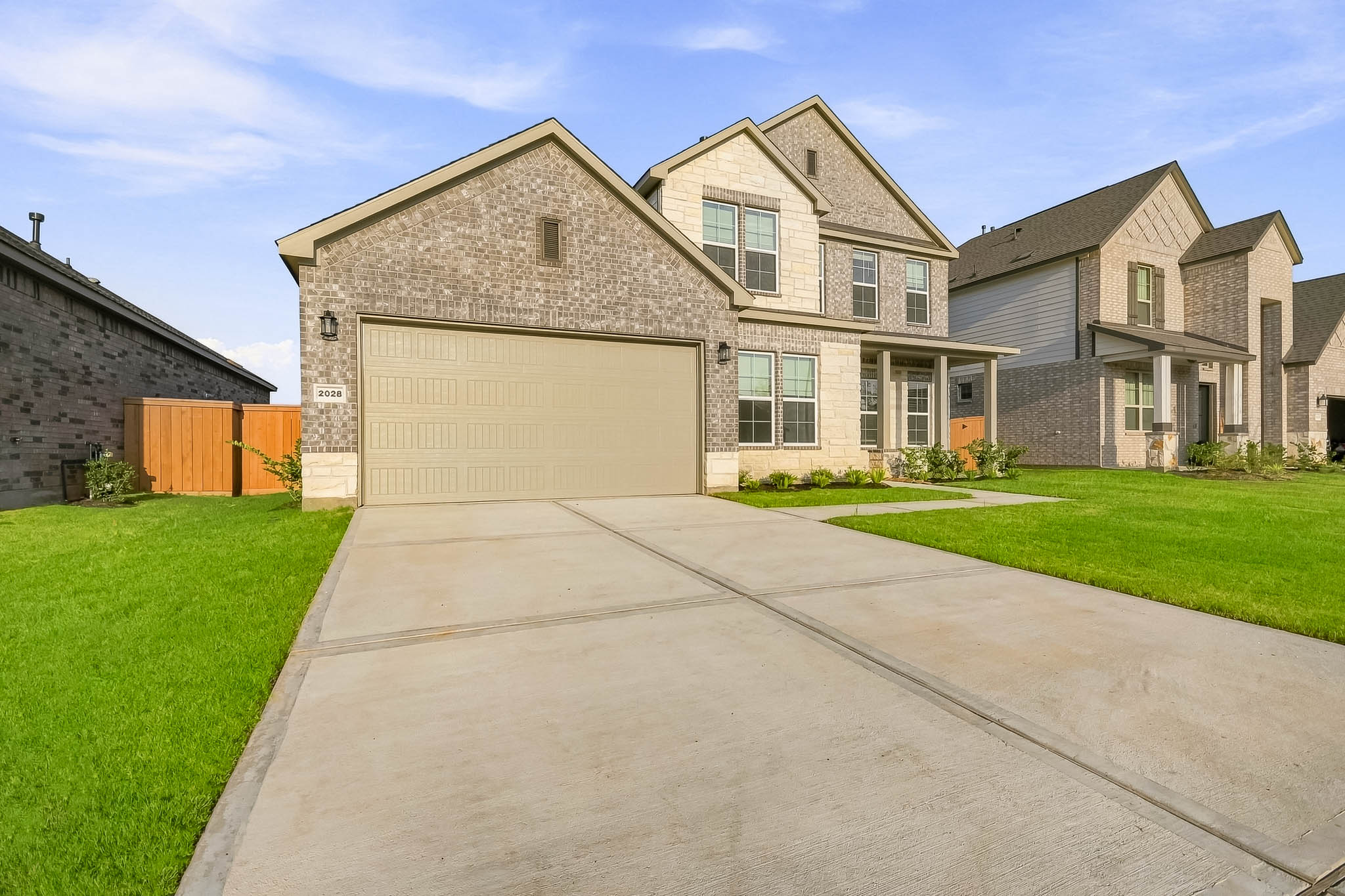 A driveway leading to a house.