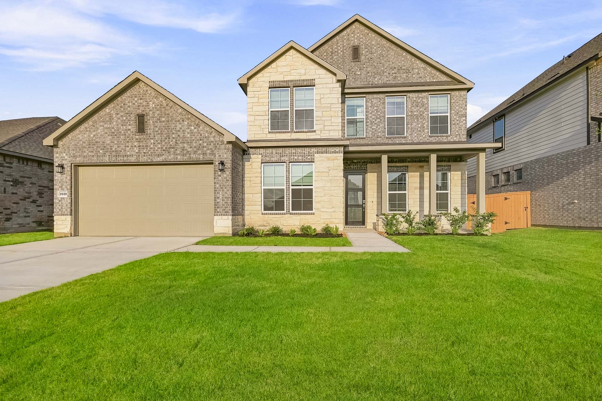 A large house with a lawn.