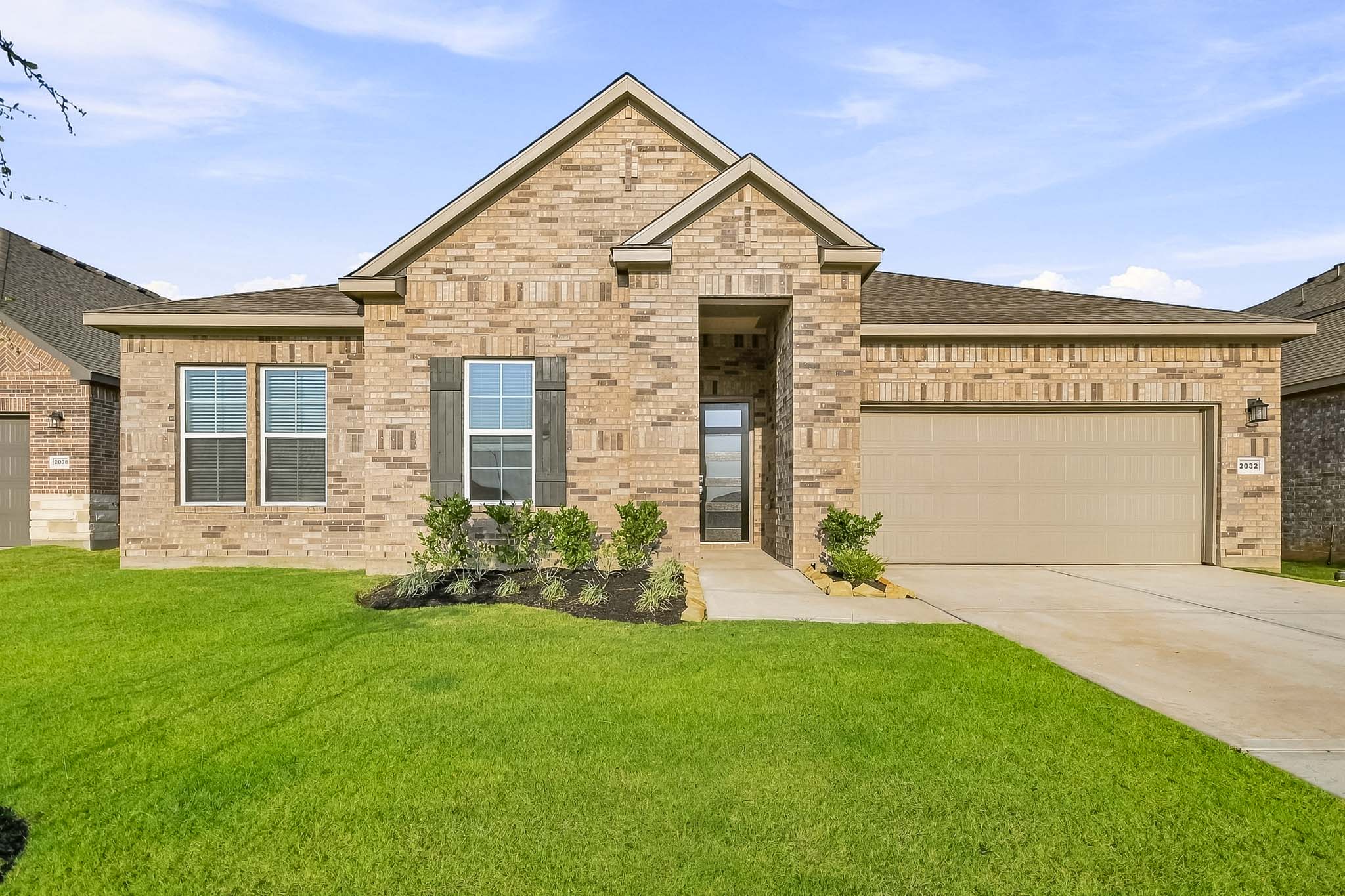 A house with a large front yard.