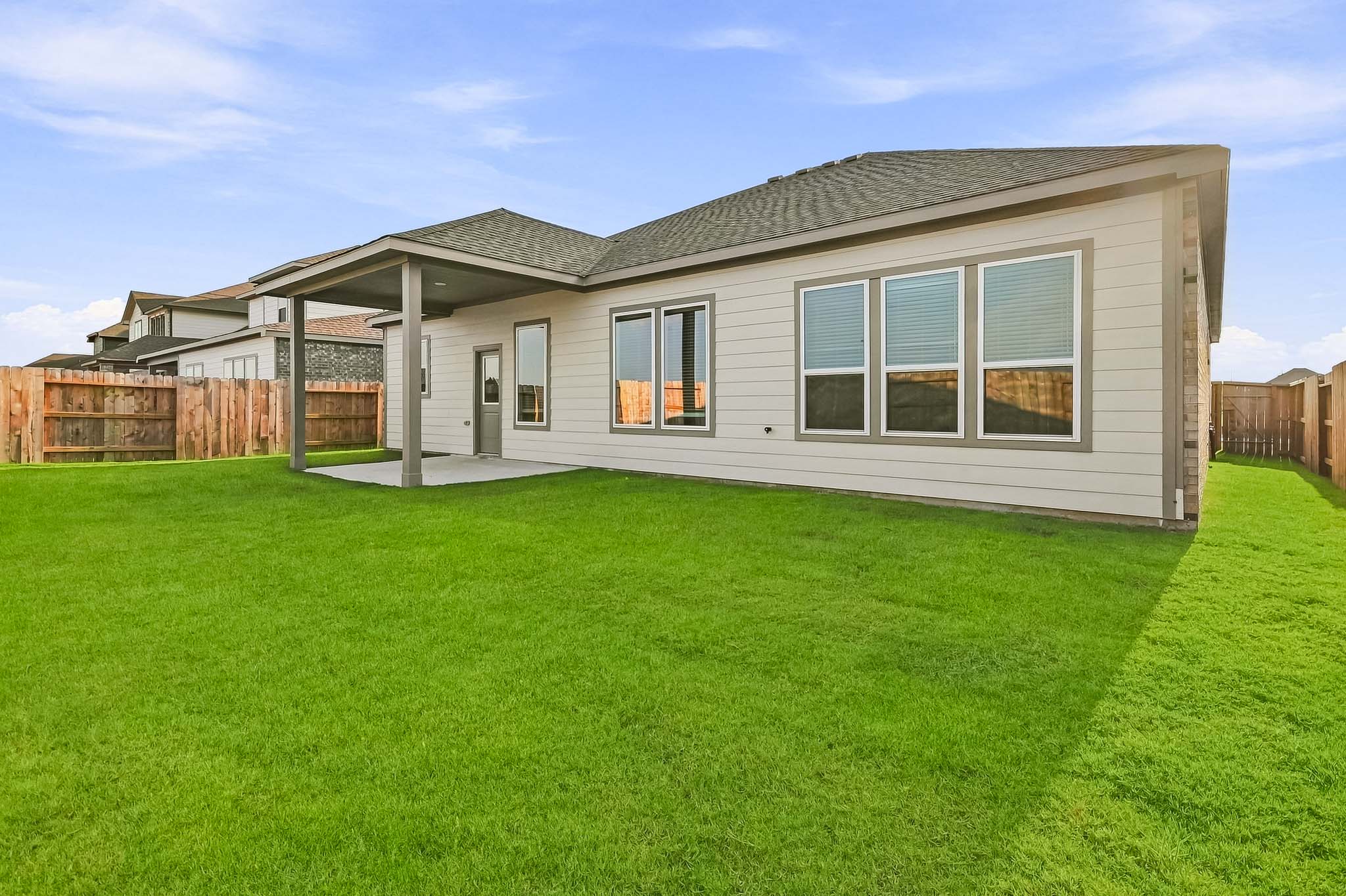 A house with a grass yard.