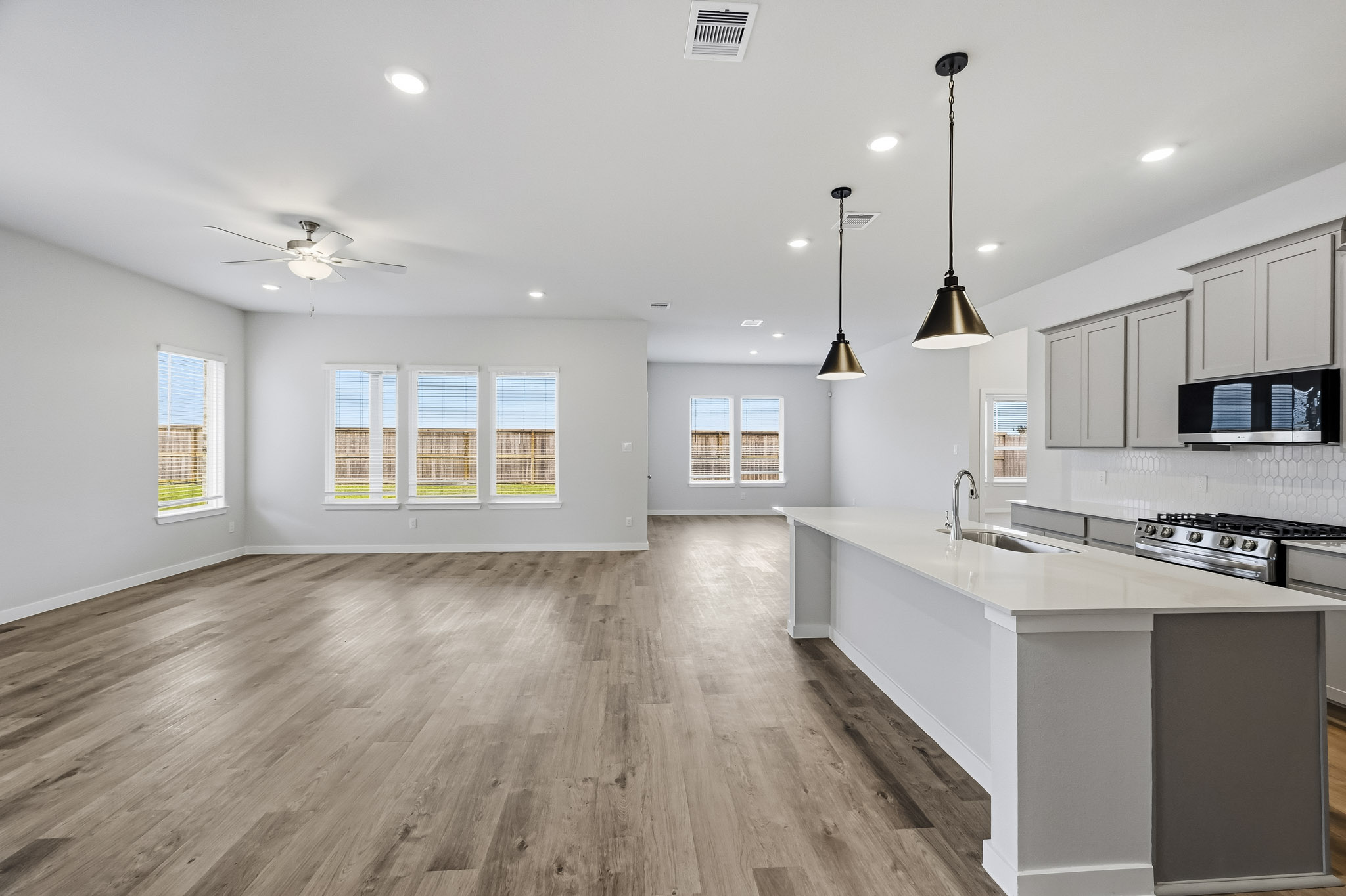 A kitchen with a wood floor.