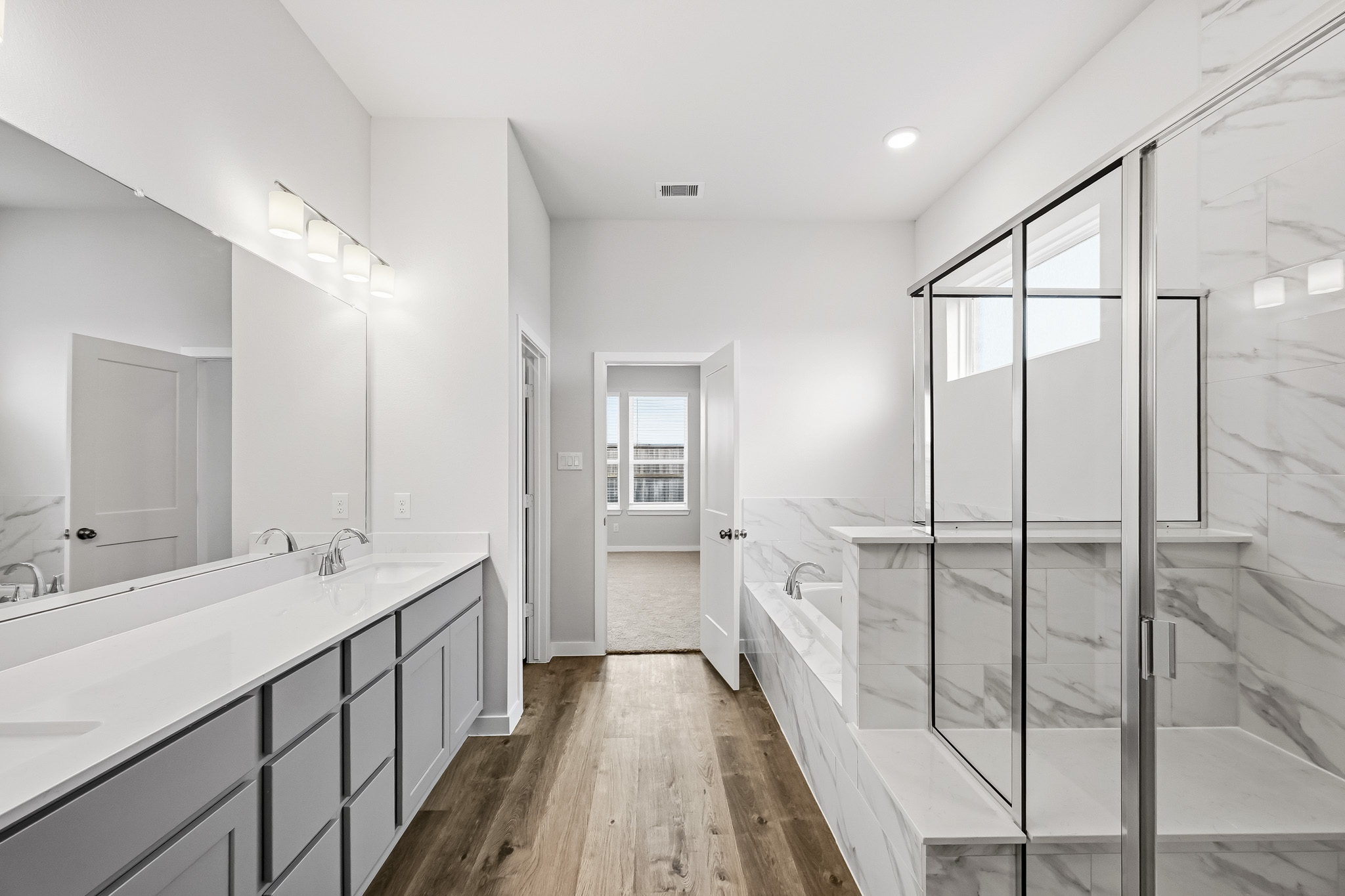 A bathroom with a glass shower.