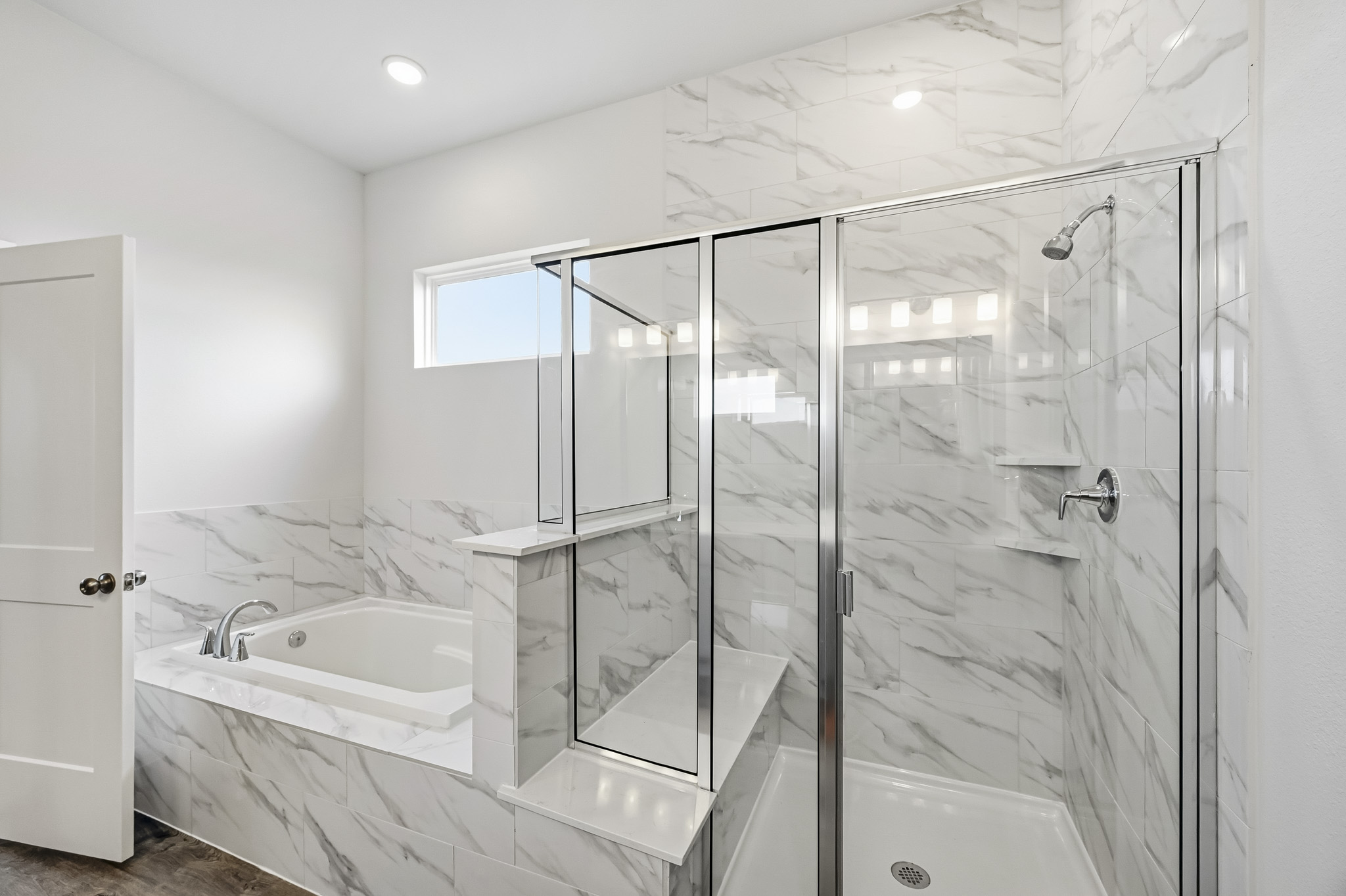 A bathroom with a glass shower.