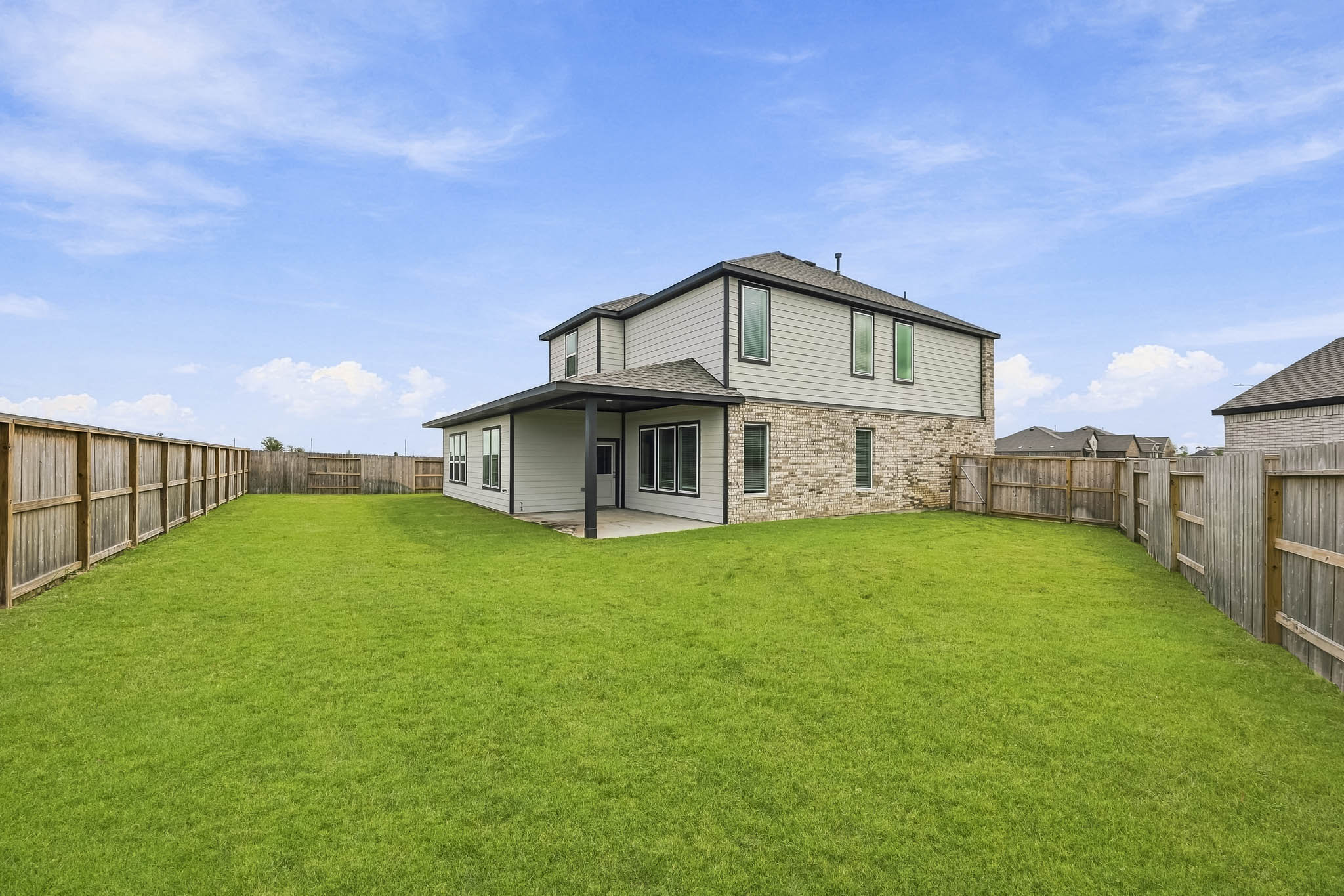 A house with a fence around it.