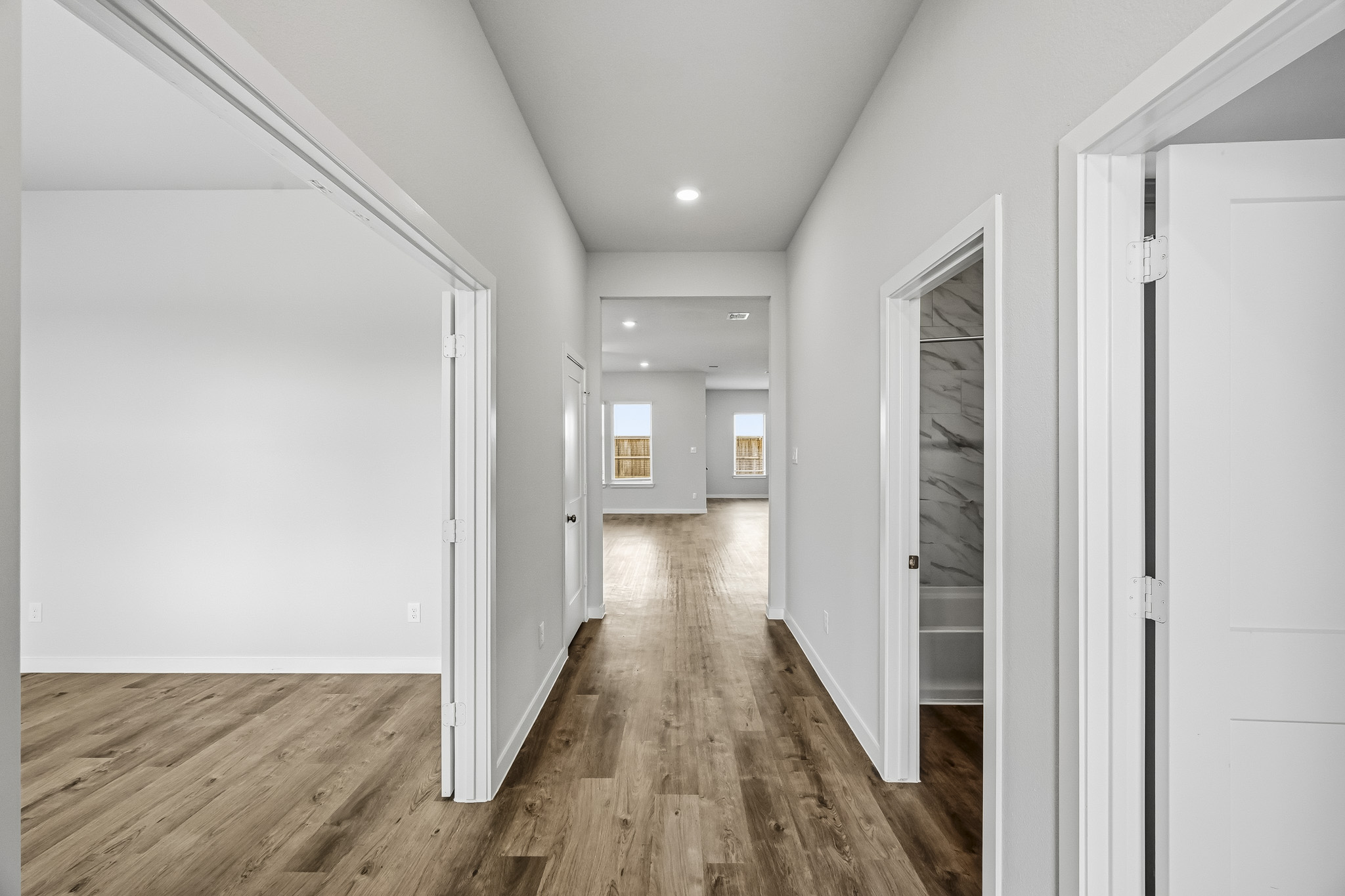 A hallway with white walls.