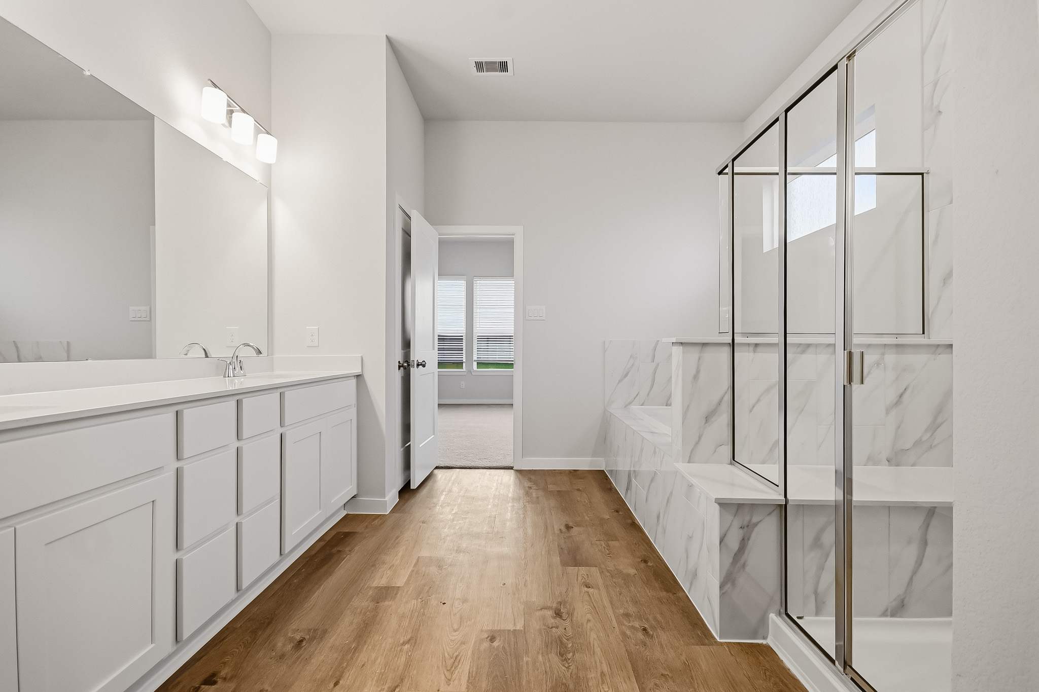 A bathroom with a glass shower.