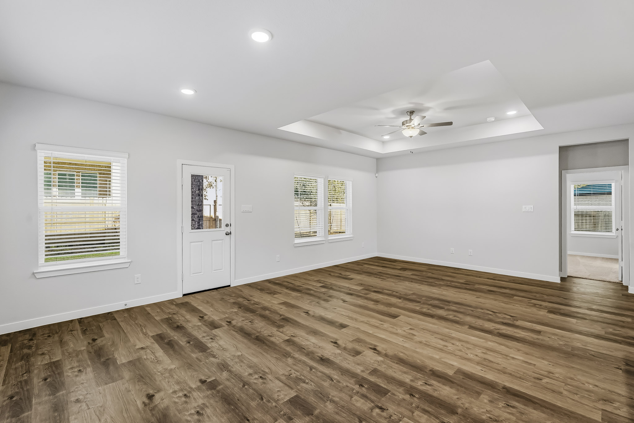 A room with a wood floor and a wood floor.