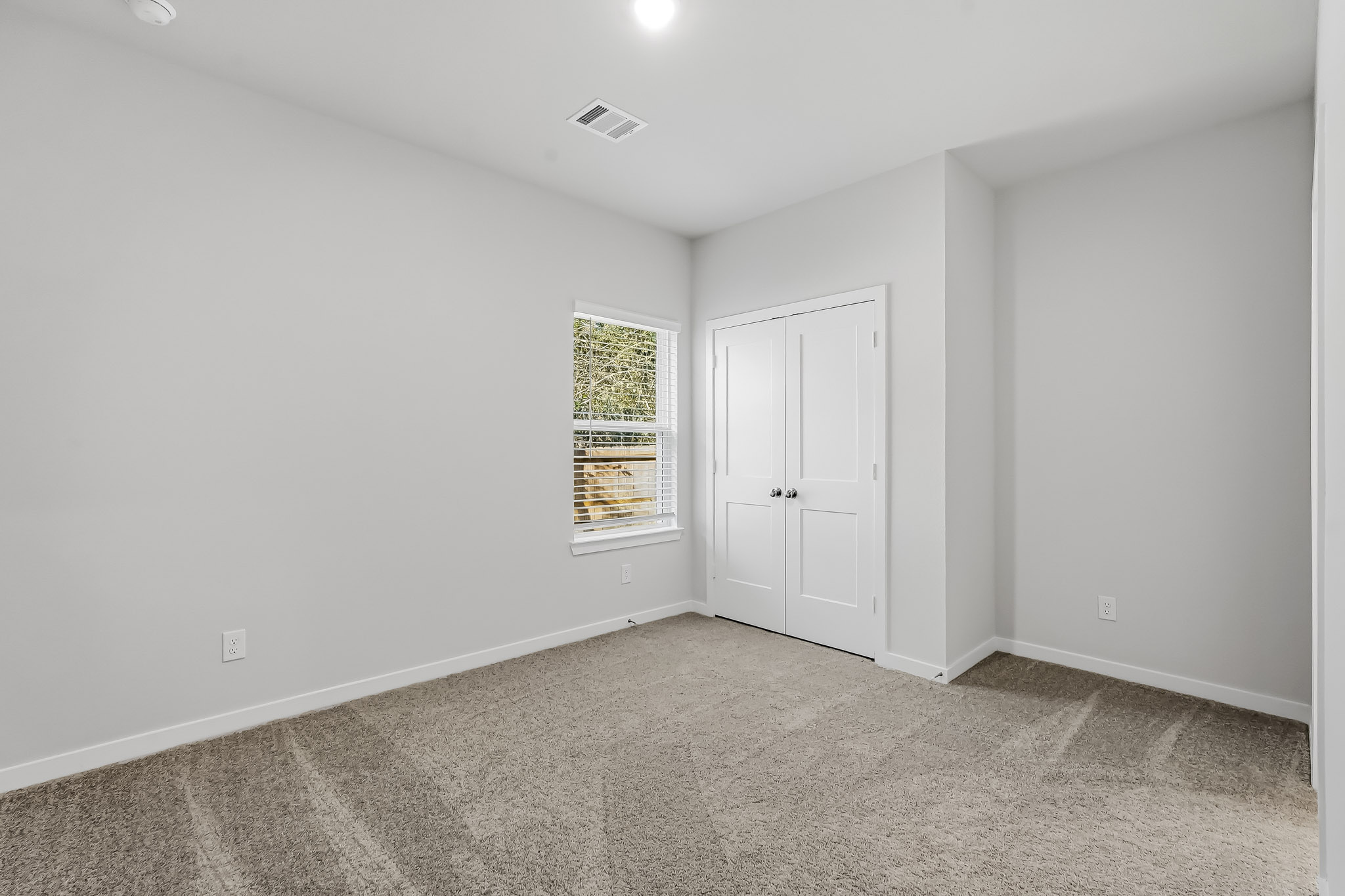 A room with white doors.