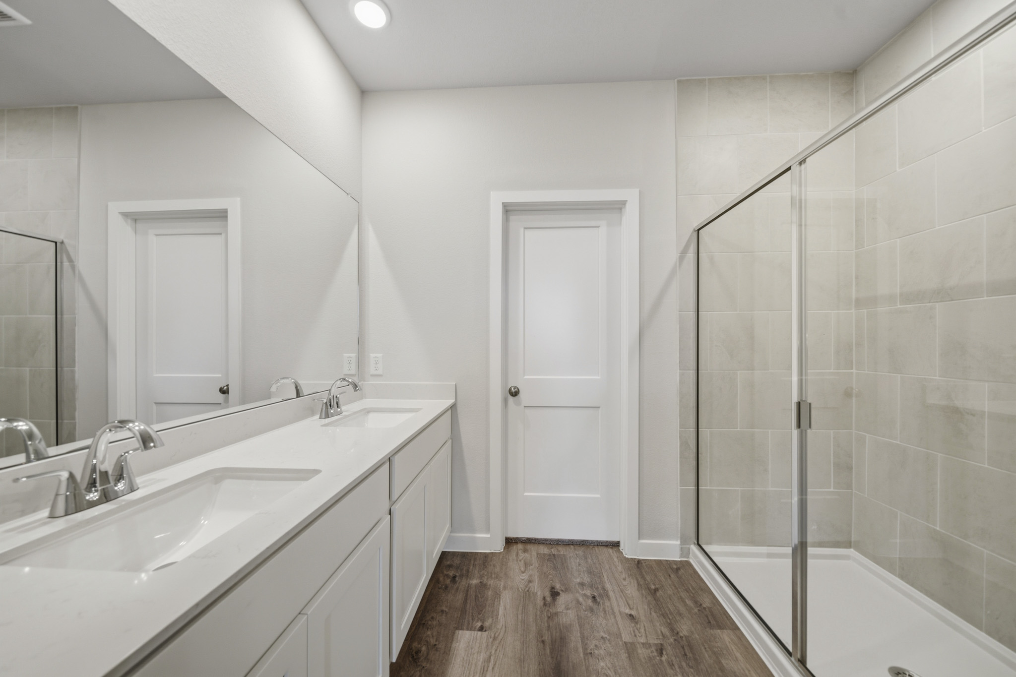 A bathroom with a glass shower.