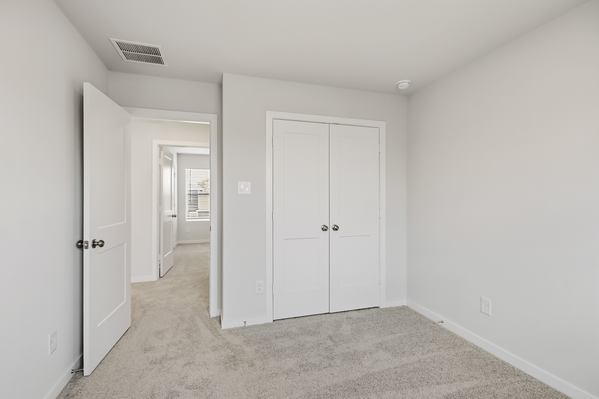 A room with white doors.