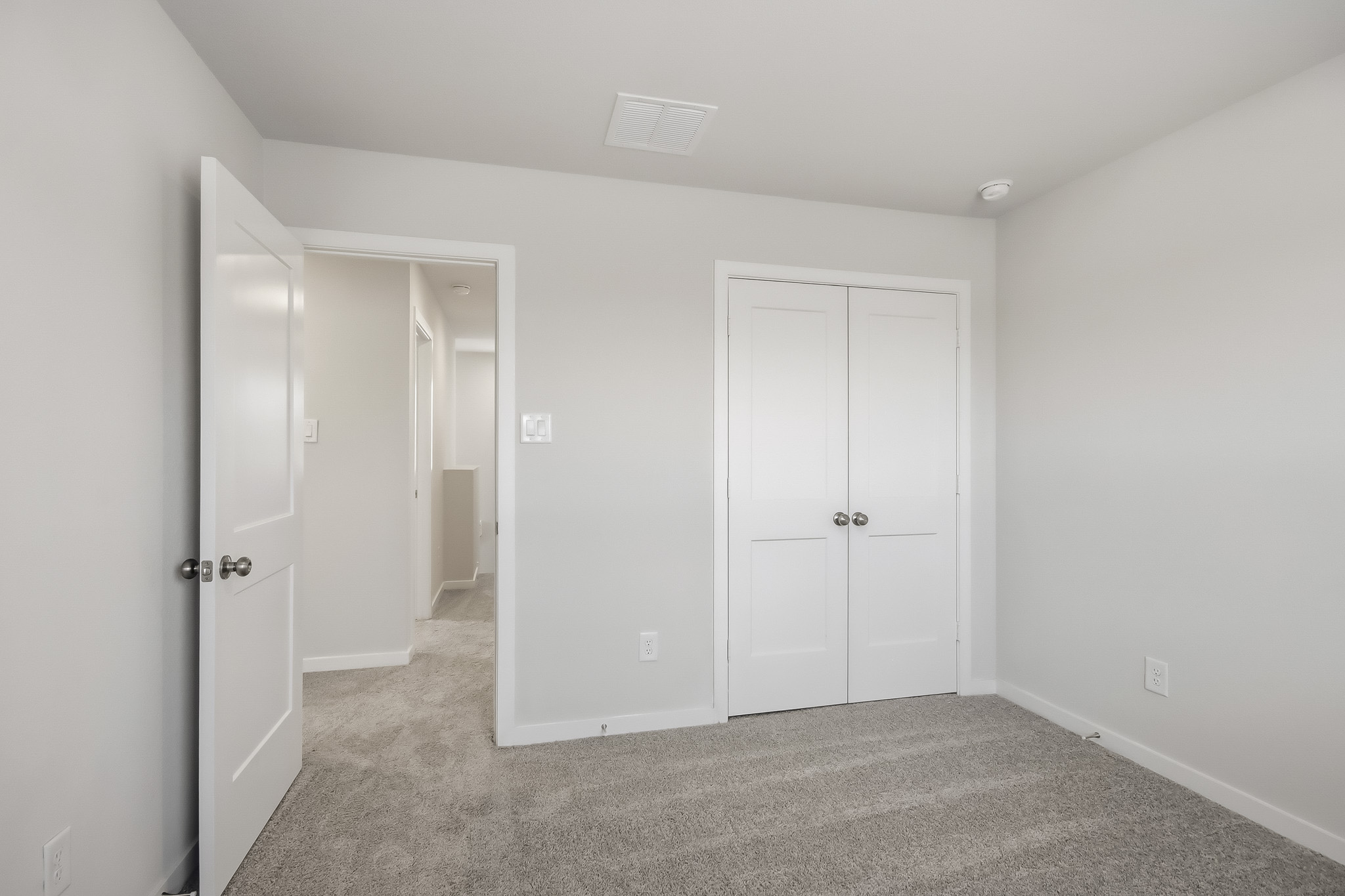 A room with white doors.