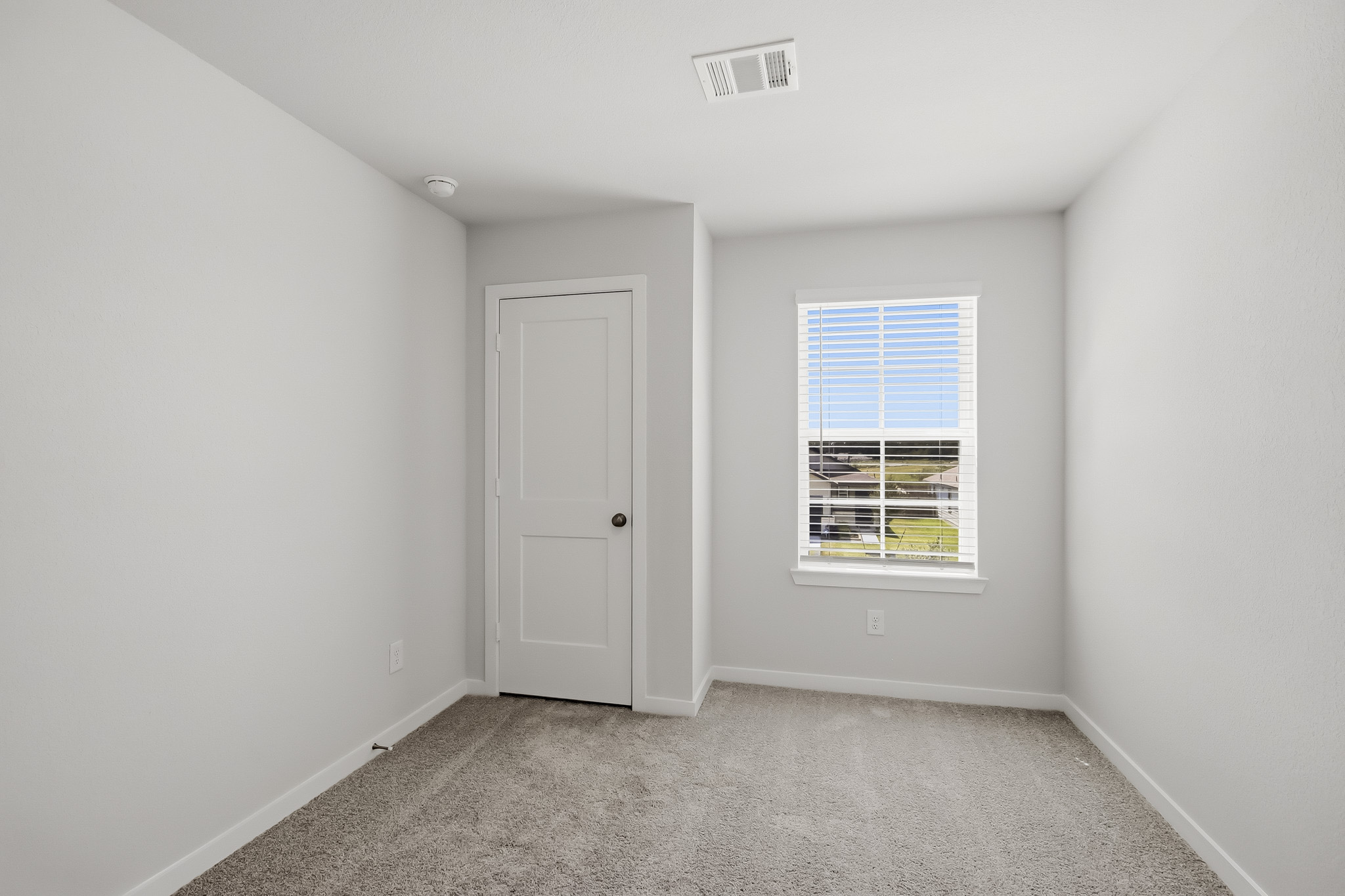 A room with a door and a window.