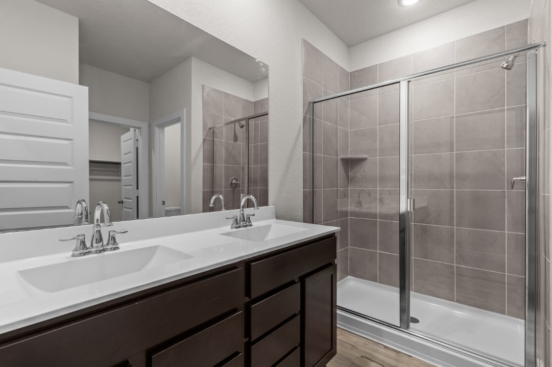 A bathroom with a glass shower.