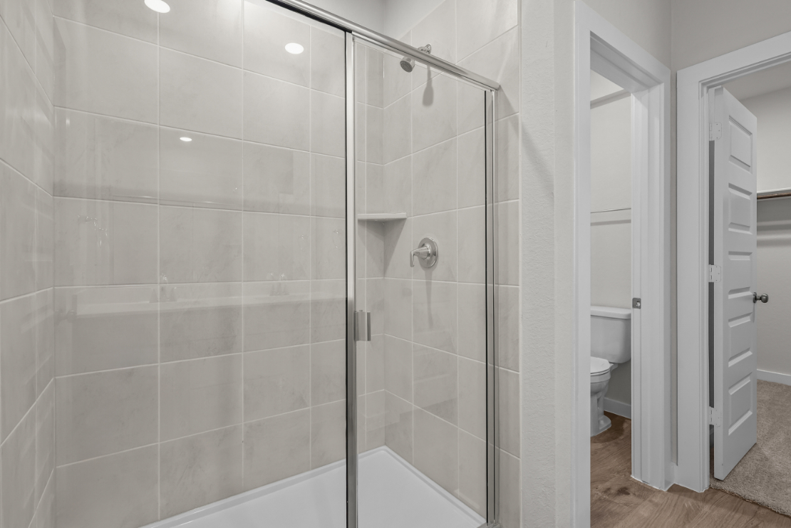 A bathroom with a glass shower.