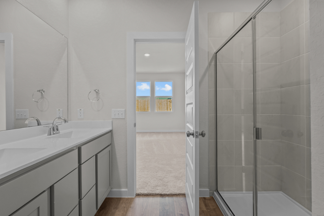 A bathroom with a glass shower.