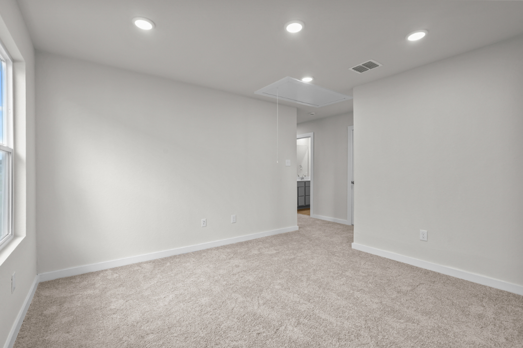 A hallway with white walls.