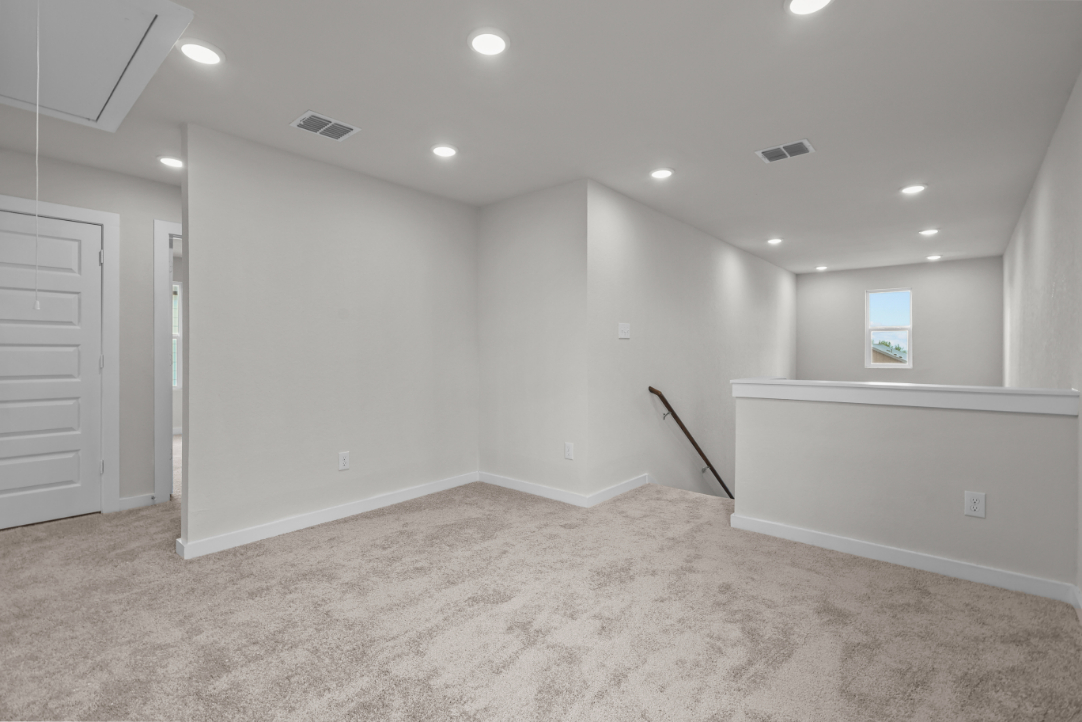 A room with a white wall and a white floor.