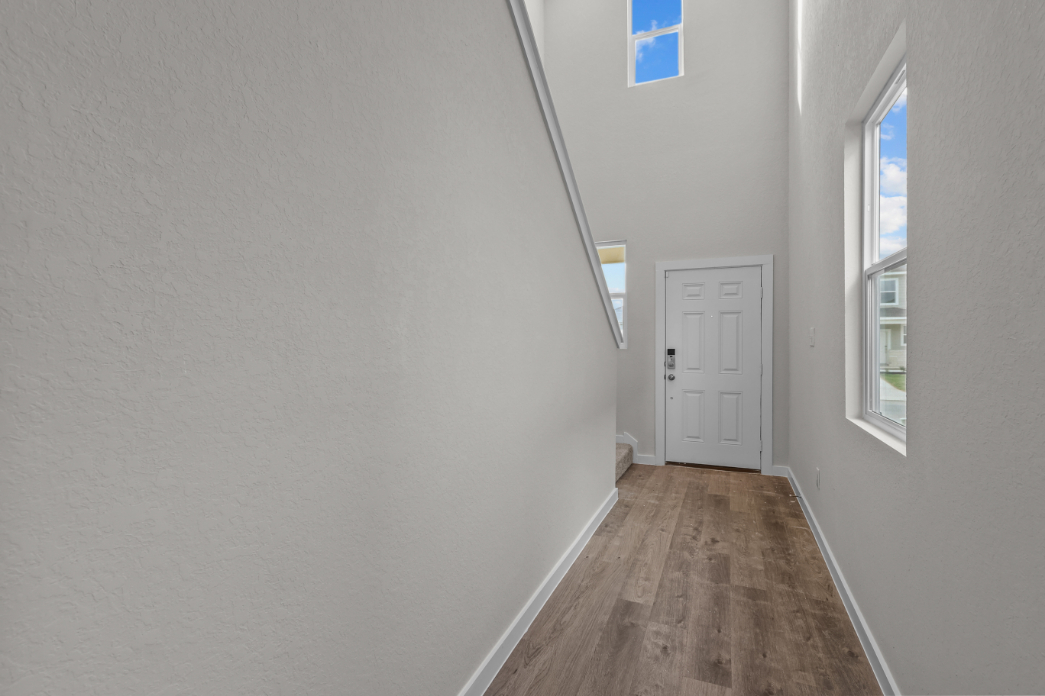 A hallway with white walls.
