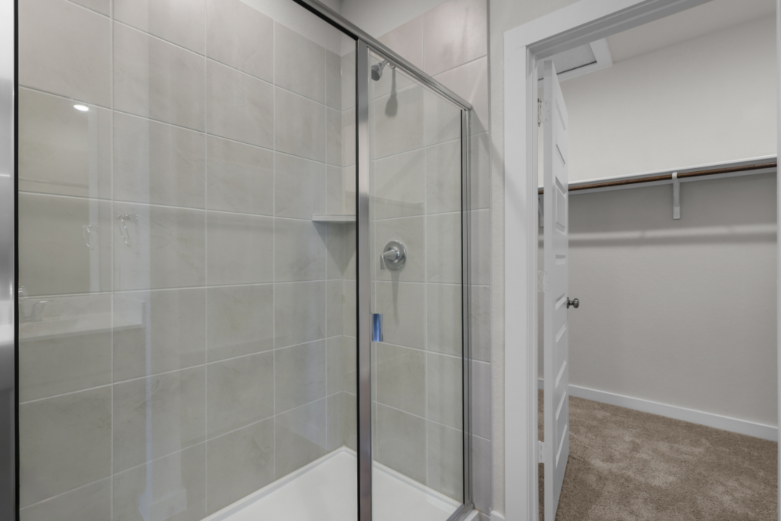 A shower with glass doors.
