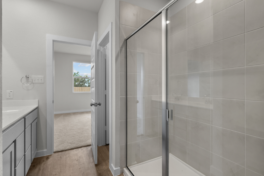 A shower with a glass door.