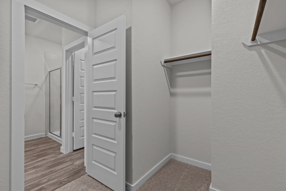 A white closet in a room.