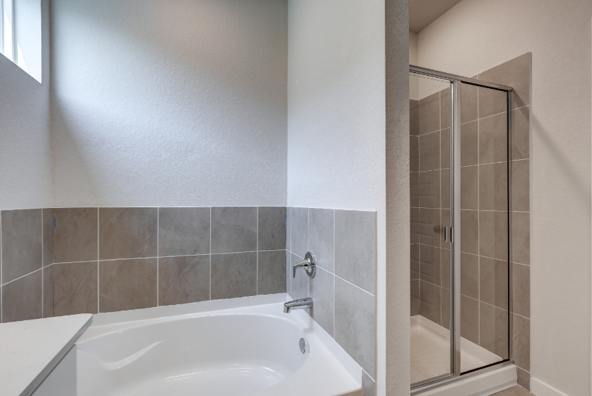 A bathroom with a glass shower.