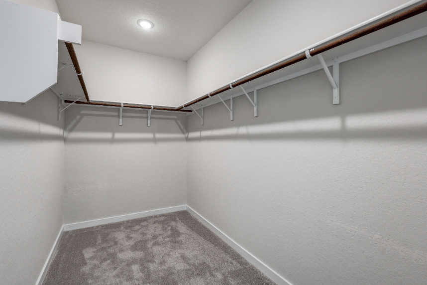 A white room with a staircase.