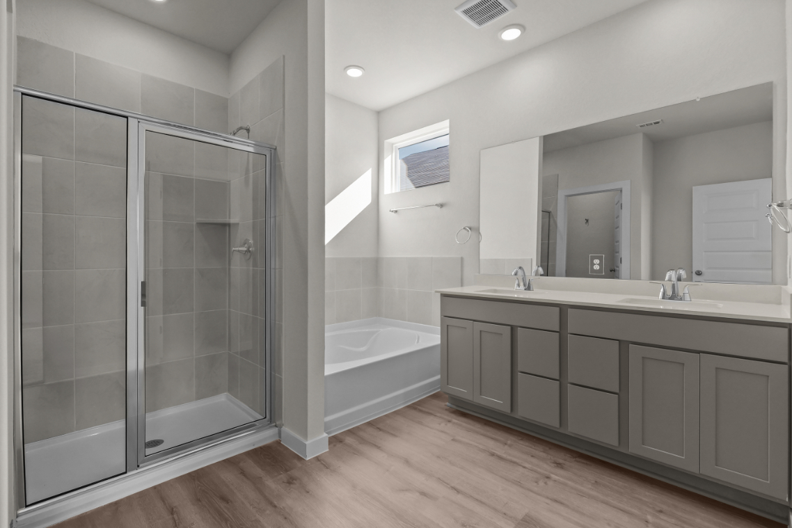 A bathroom with a glass shower.