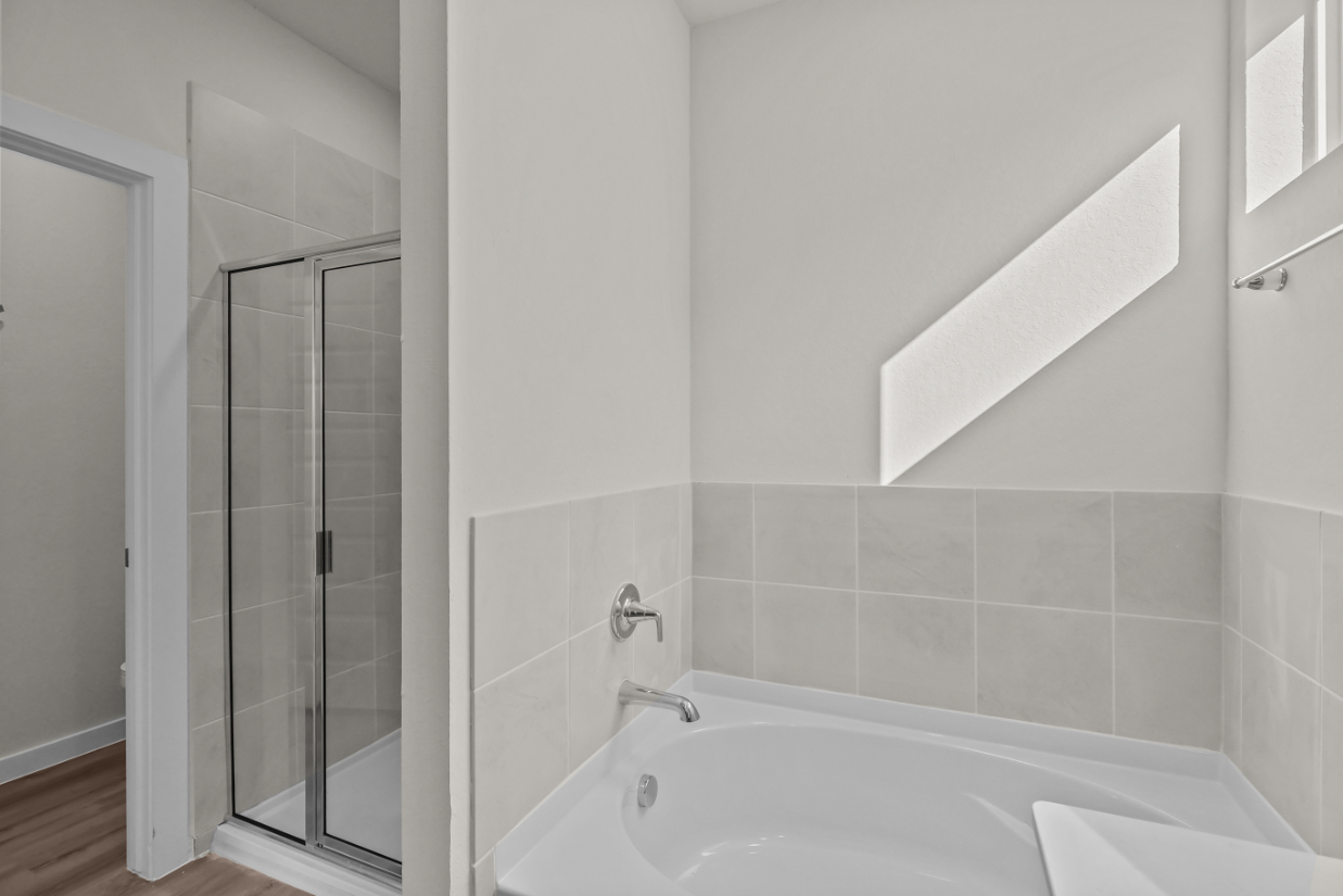 A bathroom with a glass shower.