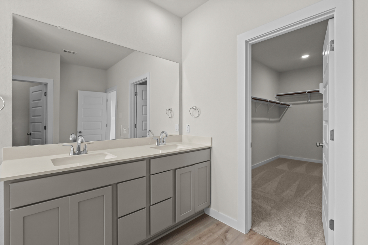 A bathroom with a shower and sink.