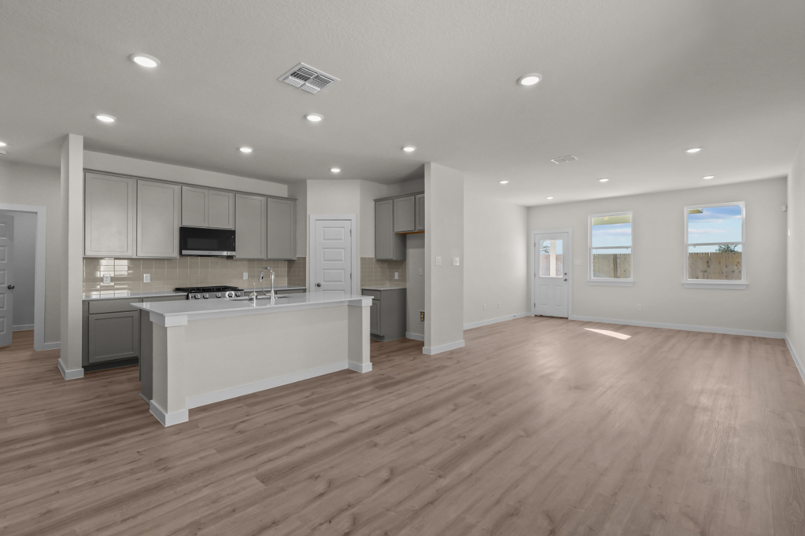 A large kitchen with white cabinets.