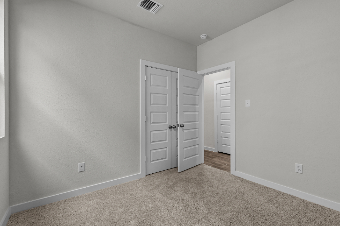 A room with white doors.
