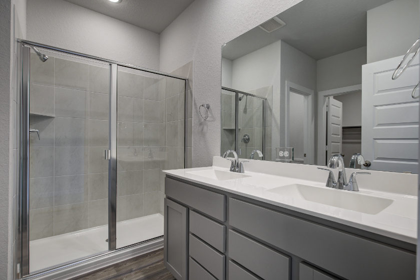 A bathroom with a glass shower.