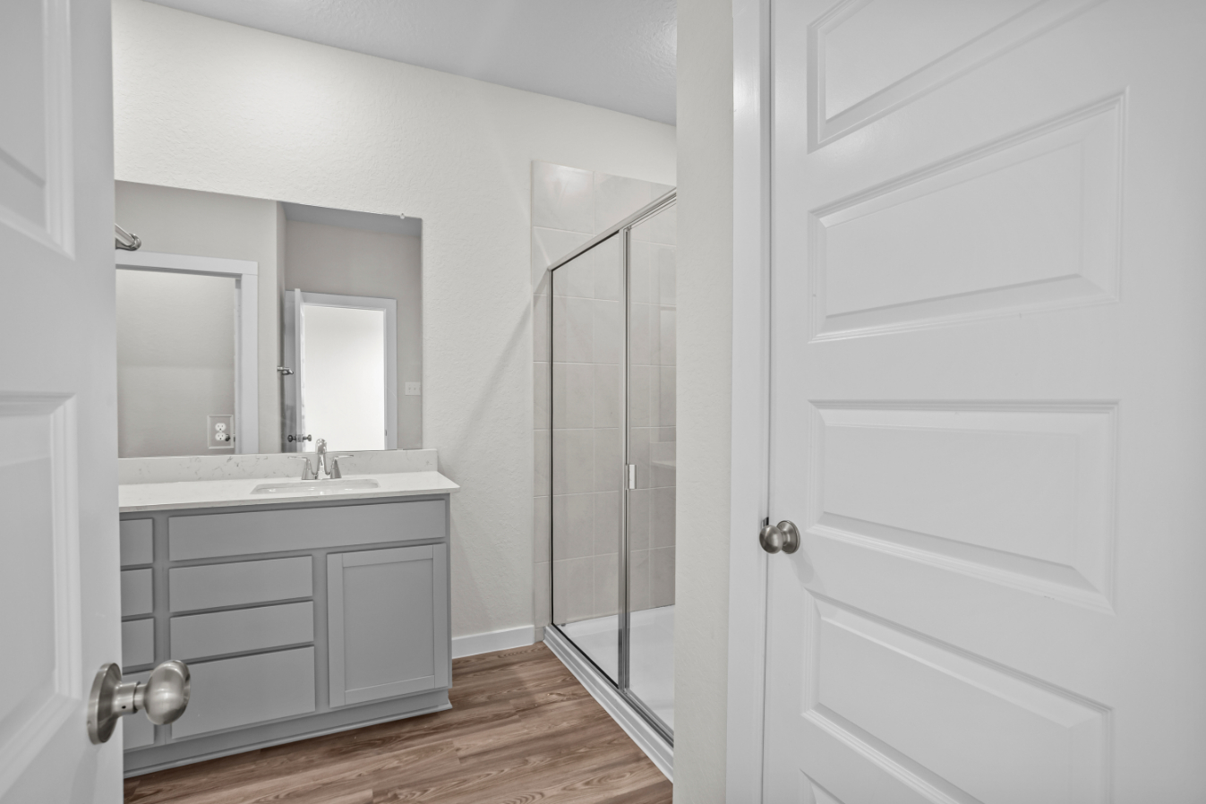 A bathroom with a glass shower.