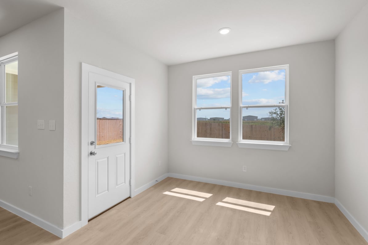 A room with a door and windows.