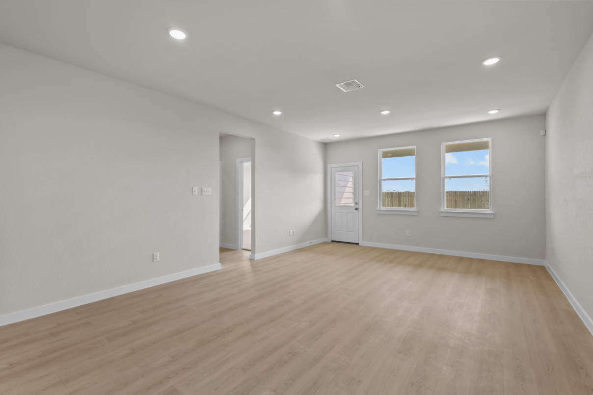 A room with a wood floor and a wood floor.