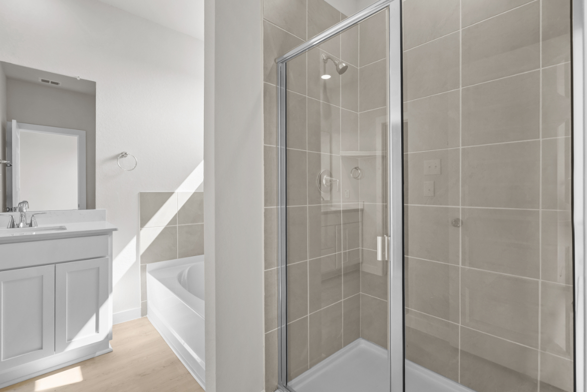 A bathroom with a glass shower.