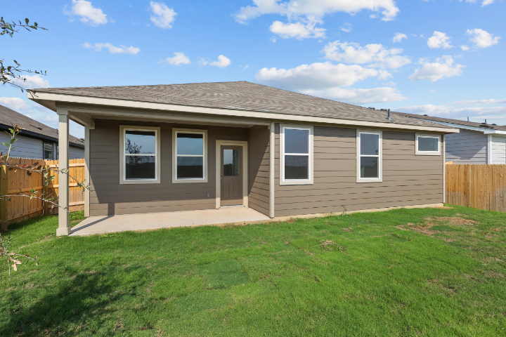 A house with a grass yard.