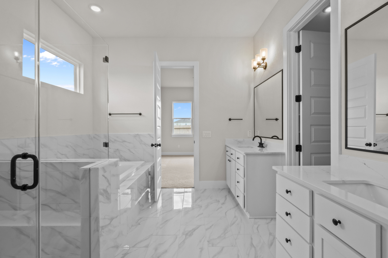 A bathroom with a glass shower.