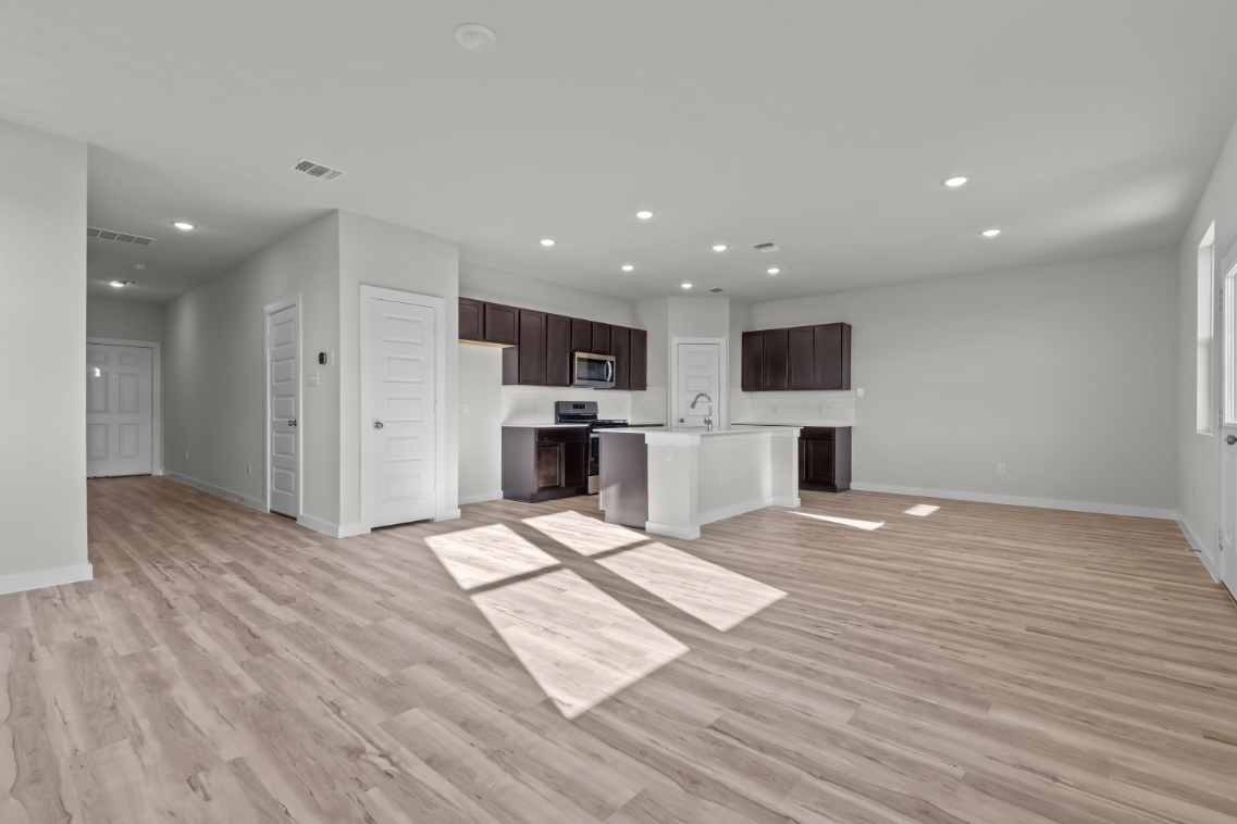 A large kitchen with white cabinets.