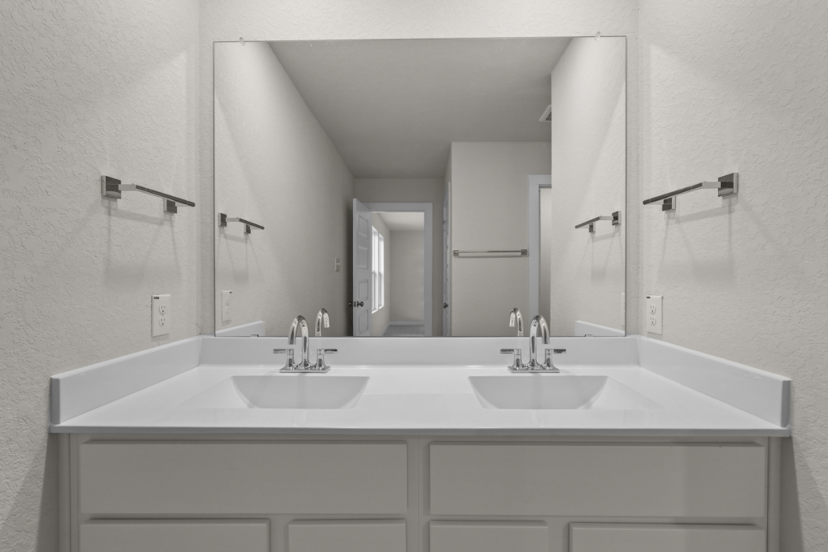 A bathroom with two sinks.