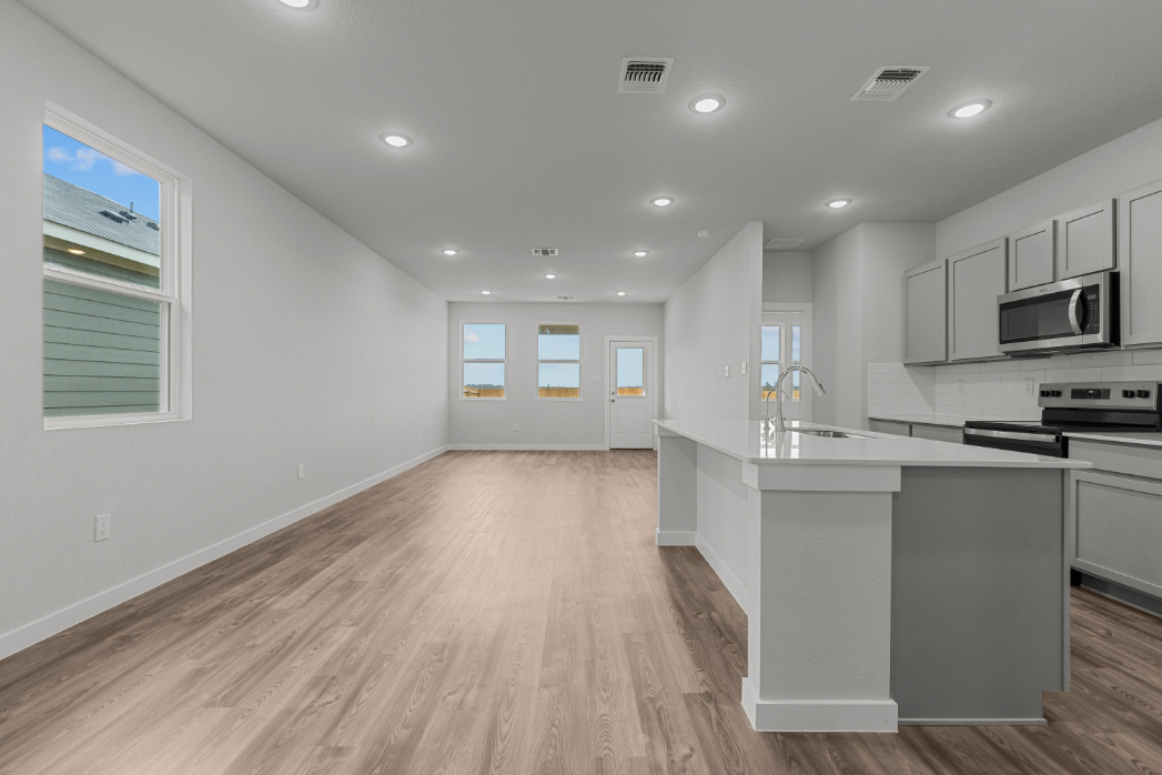 A kitchen with white walls.