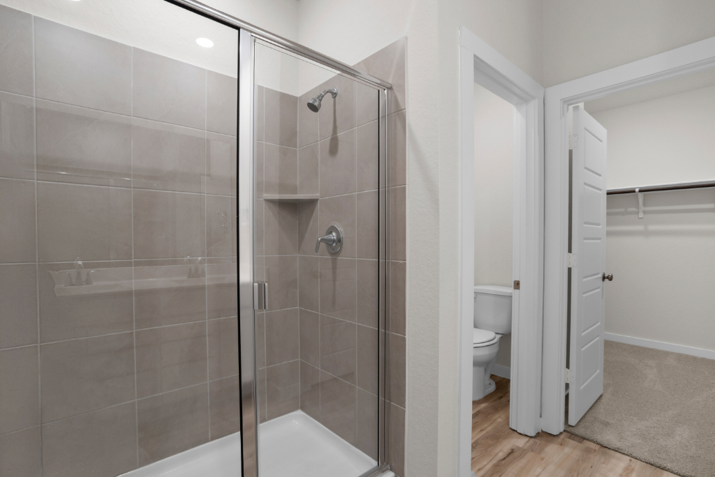A bathroom with a glass shower.