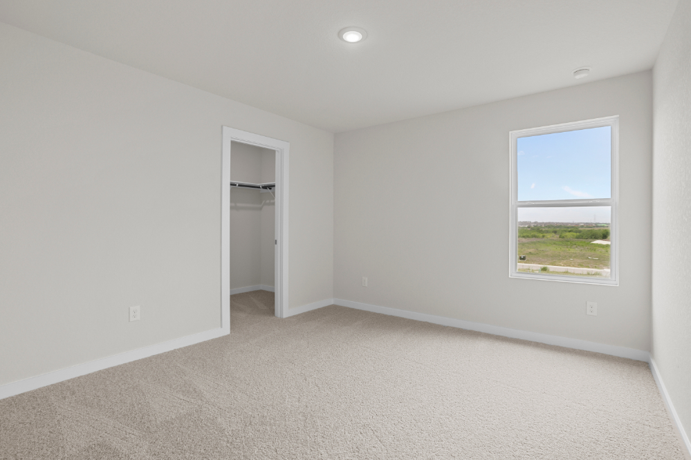 A room with a window and a door.