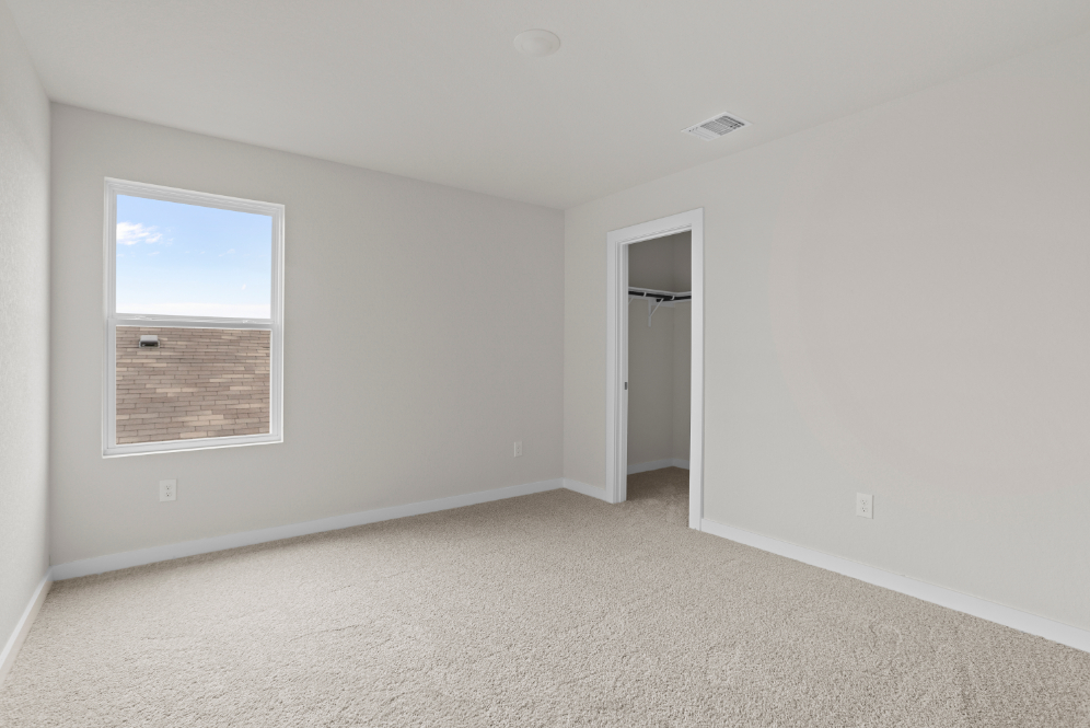 A room with a window and a door.